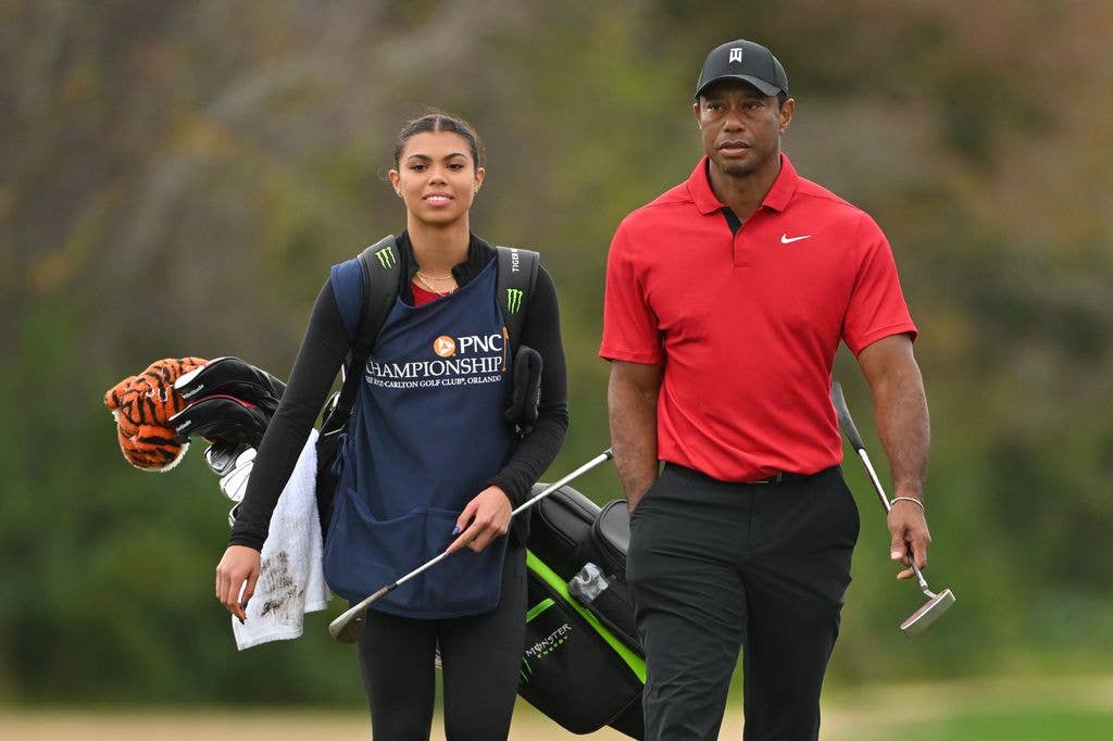 Tiger Woods and his daughter, Sam Woods, walk onto the 15th green during the final round of the PNC Championship at Ritz-Carlton Golf Club on December 17, 2023 in Orlando, Florida
