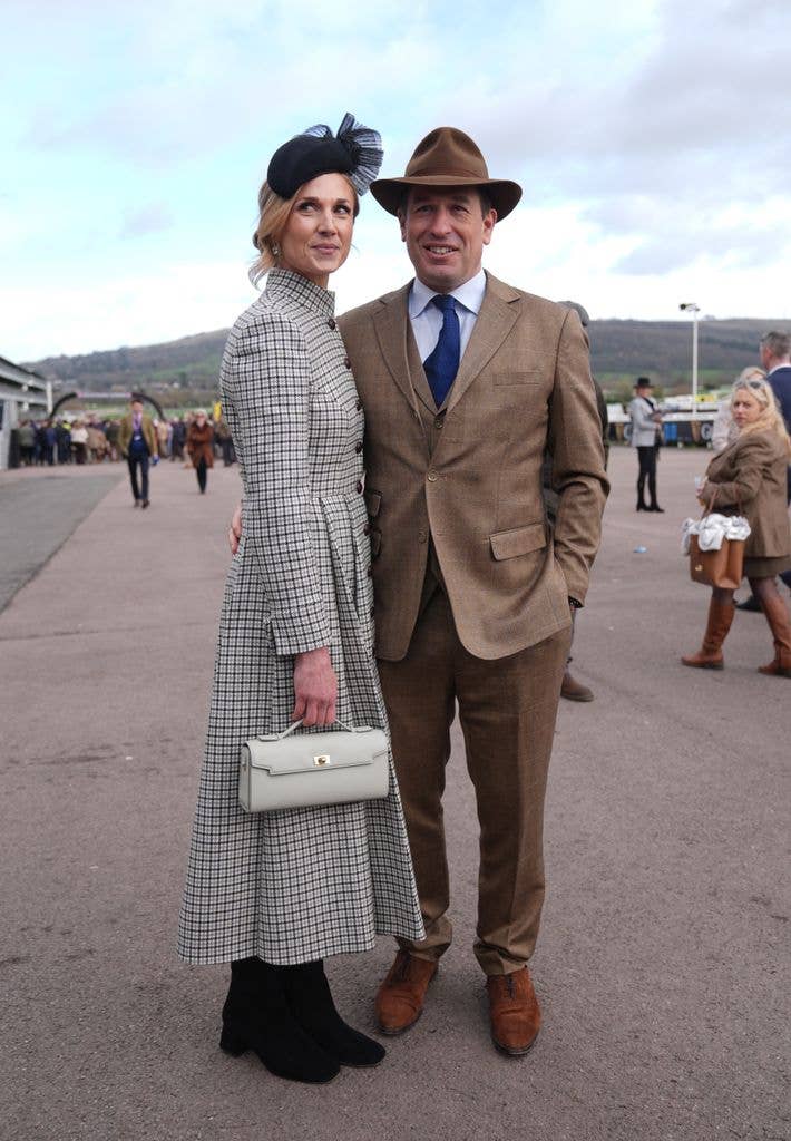 Peter Phillips in a brown suit and Harriet Sperling in a checked coat