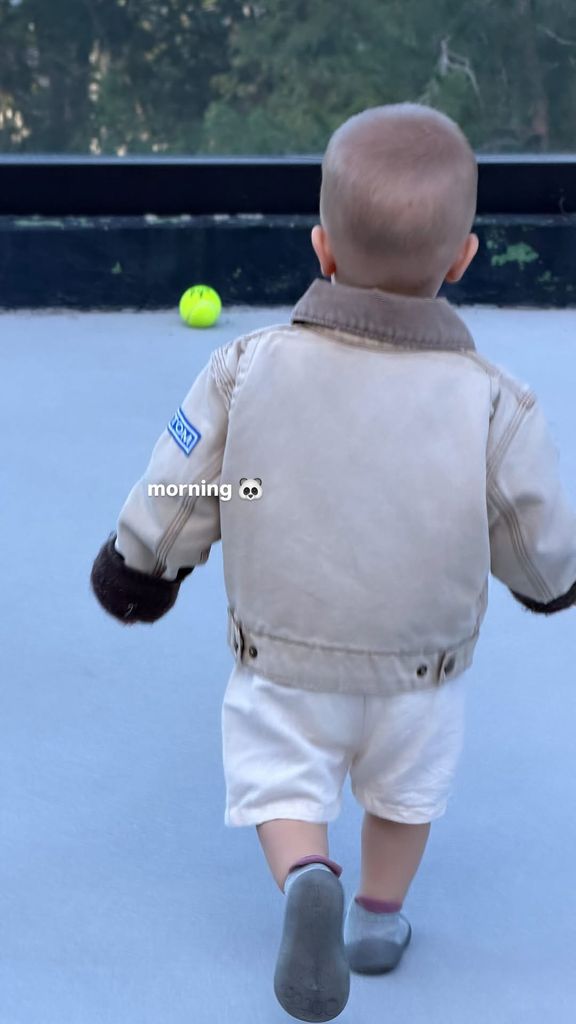 Jack Bieber in jacket and white shorts
