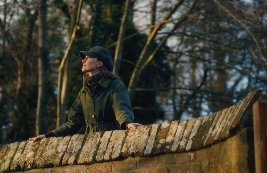 Kate Middleton standing on a bridge