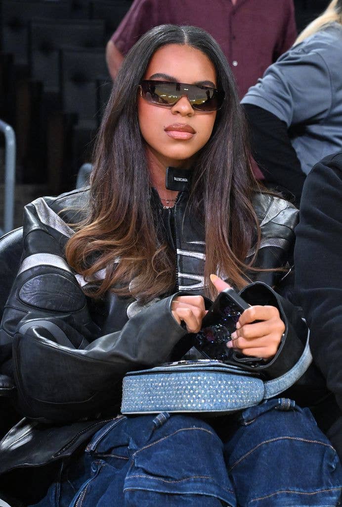 Blue Ivy in a biker jacket and jeans