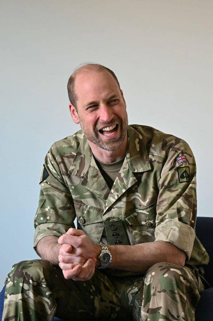 man in army uniform laughing
