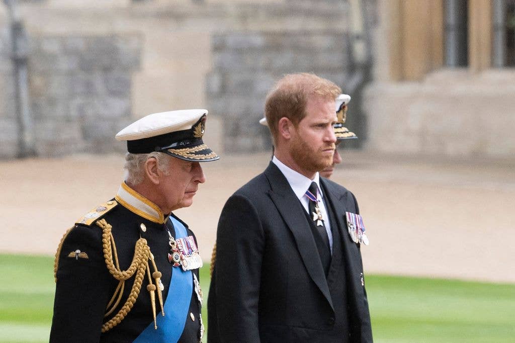 Britain's King Charles III (L) walks with his son Britain's Prince Harry, Duke of Sussex as they arrive at St George's Chapel inside Windsor Castle on September 19, 2022, ahead of the Committal Service for Britain's Queen Elizabeth II. Monday's committal service is expected to be attended by at least 800 people, most of whom will not have been at the earlier State Funeral at Westminster Abbey. (Photo by David Rose / POOL / AFP) (Photo by DAVID ROSE/POOL/AFP via Getty Images)