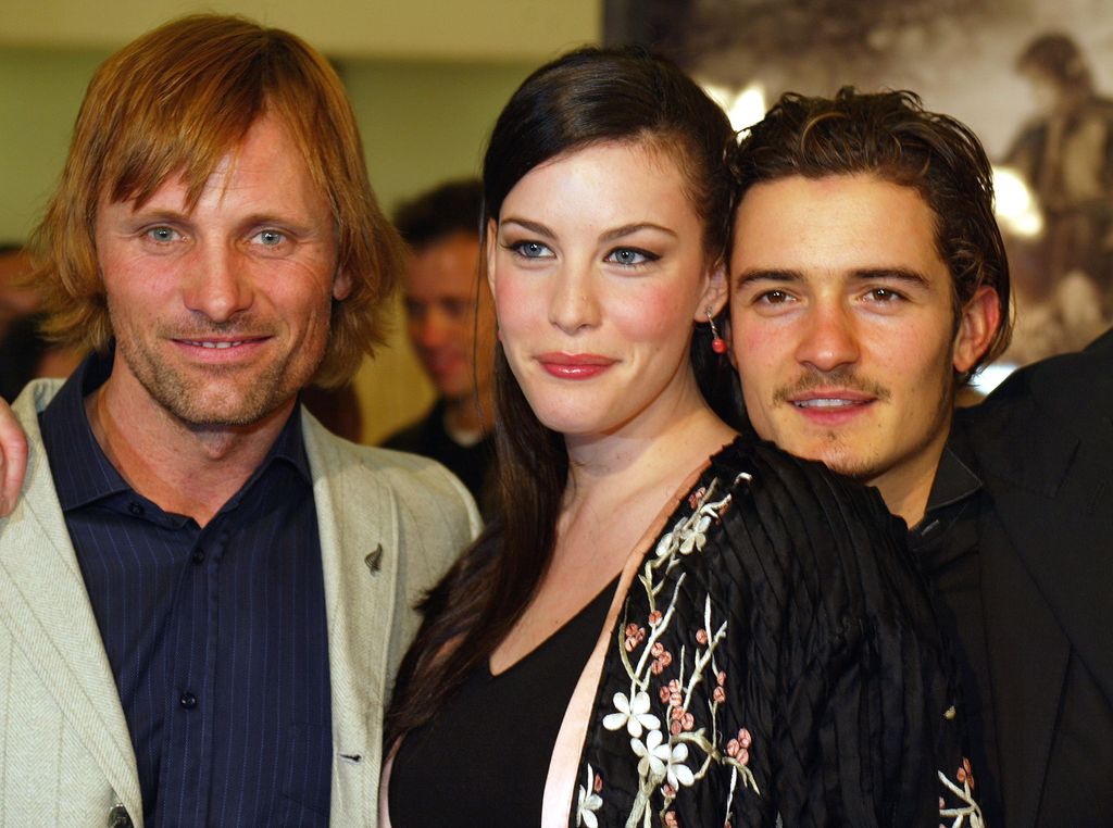 Viggo Mortensen, Liv Tyler and Orlando Bloom stand together at the premiere of The Lord of the Rings: The Two Towers.