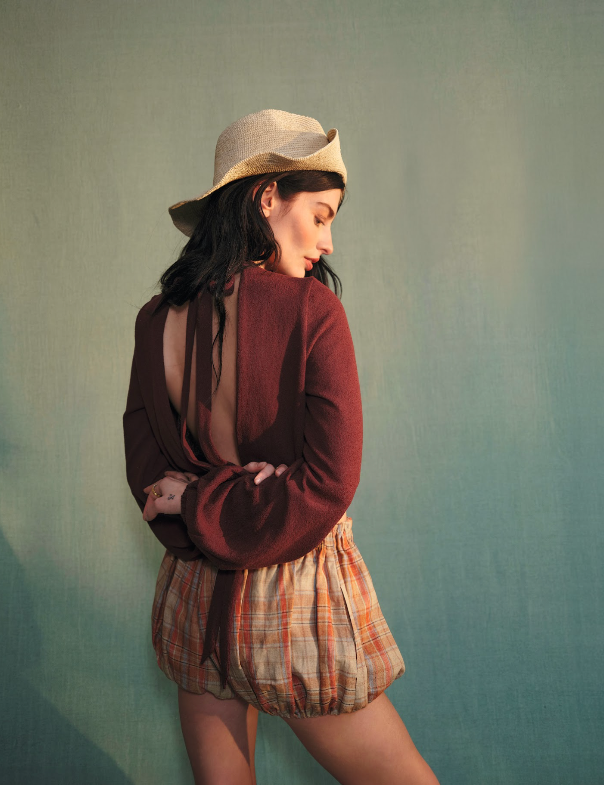 Top, £295, Shorts, £325, Hat, £110, all Longchamp, Jewellery, stylist’s own