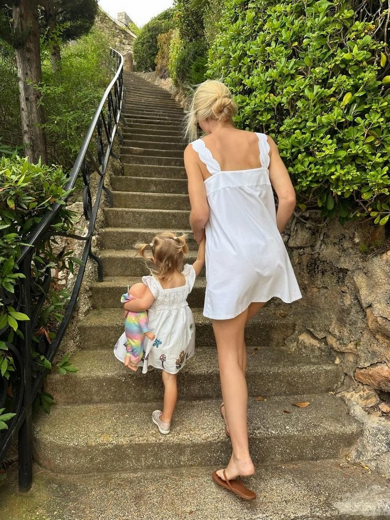 Athena and Lady Kitty going up outdoor steps