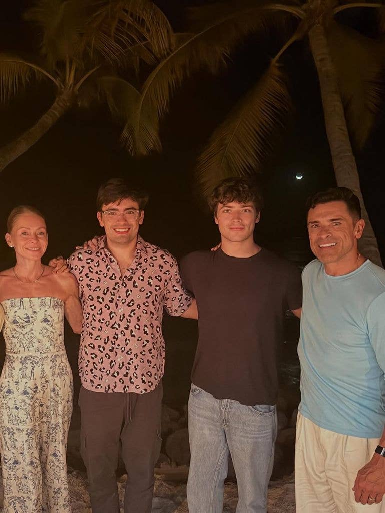 Kelly Ripa and Mark Consuelos' sons Michael and Joaquin towered over their parents as they posed on the beach