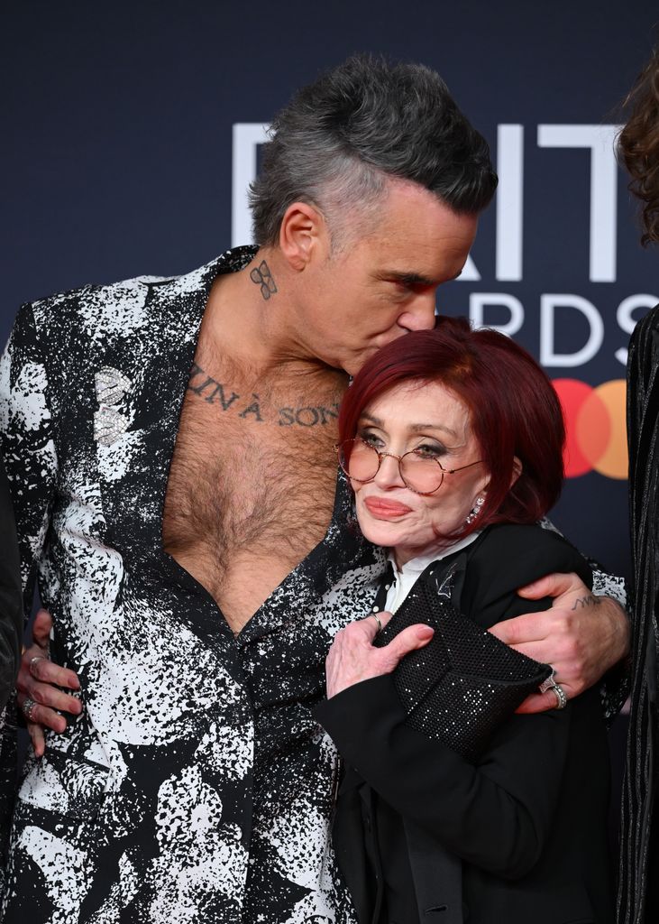 Robbie Williams and Sharon Osbourne attends The BRIT Awards 2026 at Co-op Live on February 28, 2026 in Manchester, England. (Photo by Karwai Tang/WireImage)