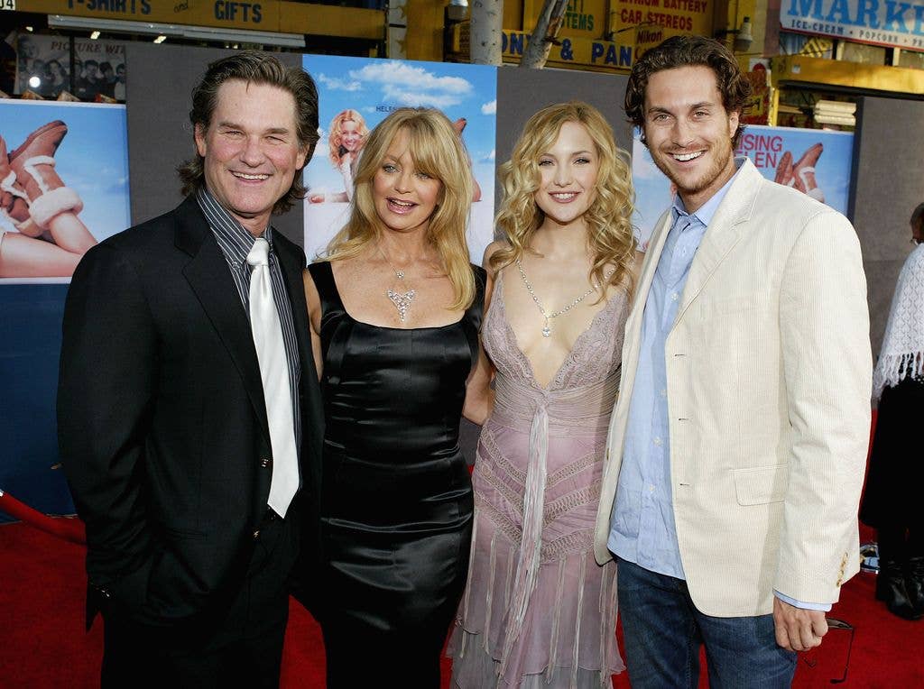 Actor Kurt Russell, his partner, actress Goldie Hawn, and her children, actress Kate Hudson and actor Oliver Hudson, attend the film premiere of the romantic comedy "Raising Helen" on May 26, 2004 at the El Capitan Theatre, in Hollywood, California.