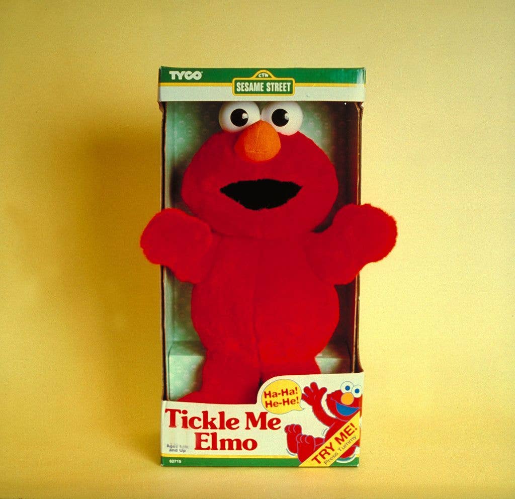 Tickle Me Elmo doll in its original box.