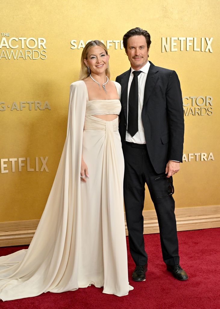 Kate Hudson in ivory dress and Oliver Hudson  in suit attend the 32nd Annual Actor Awards