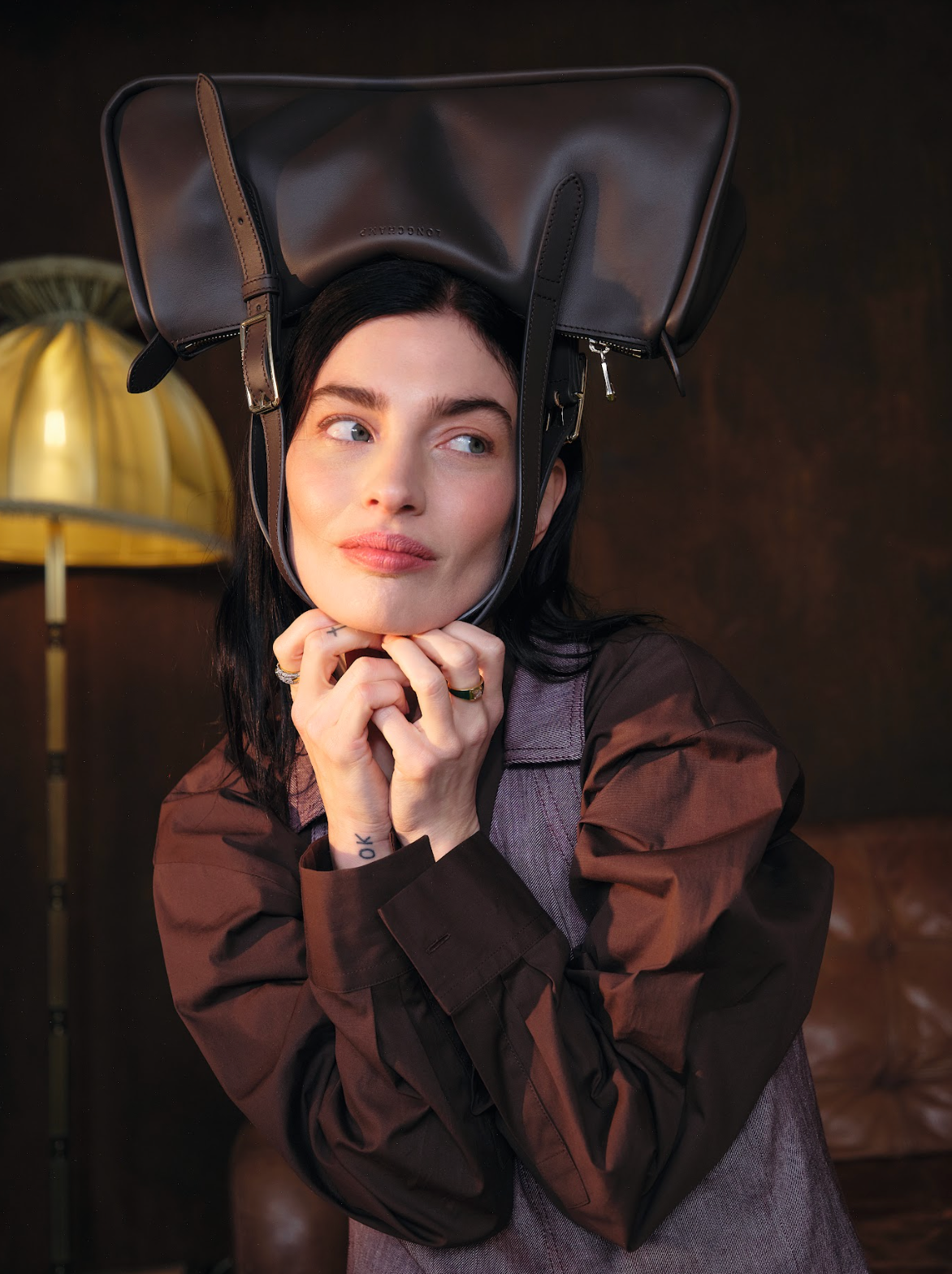 sydney lima with bag on her head