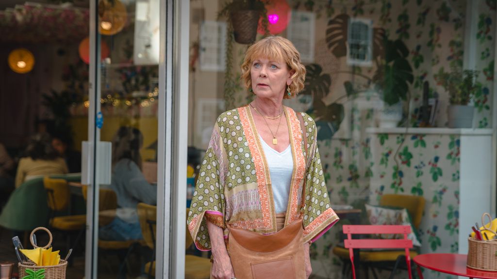 Woman standing outside shop