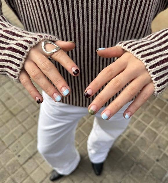 Spring transition manicure combining pastel sky blue with khaki green and chocolate brown accent nails