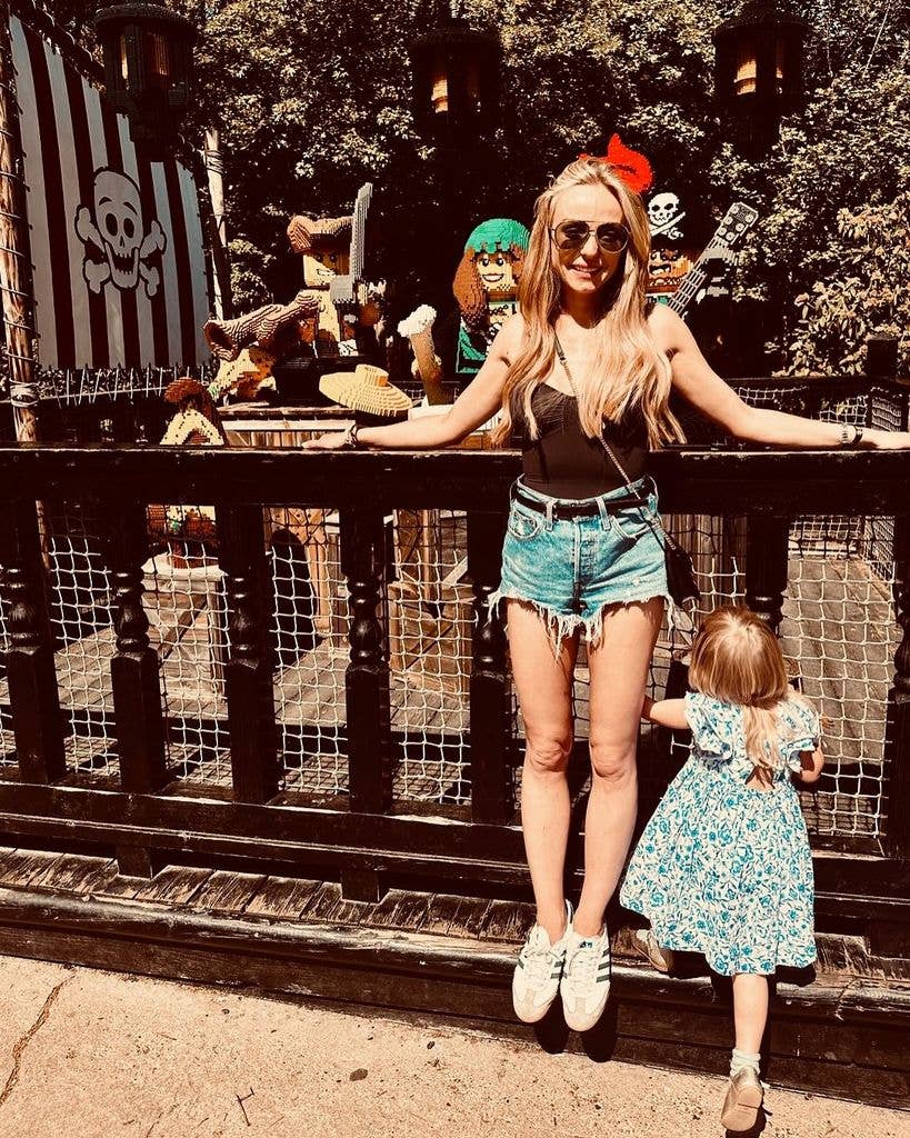 mother posing with young daughter at legoland