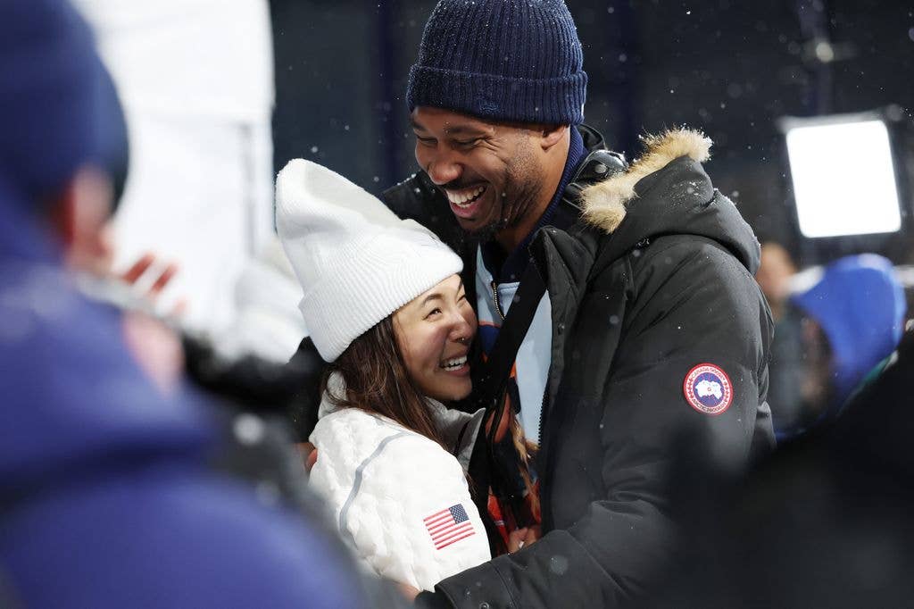 Silver medalist Chloe Kim of Team United States celebrates with boy friend Myles Garrett after the Womenâs Snowboard Halfpipe on day six of the Milano Cortina 2026 Winter Olympic games at Livigno Snow Park on February 12, 2026 in Livigno, Italy