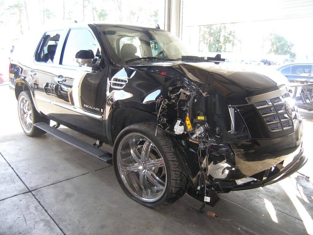 In this handout photo provided by The Florida Highway Patrol, the vehicle driven by Tiger Woods during his accident is seen on December 2, 2009 in Orlando, Florida. Woods crashed the SUV into the fire hydrant and tree next to his Florida home in the early hours of November 27