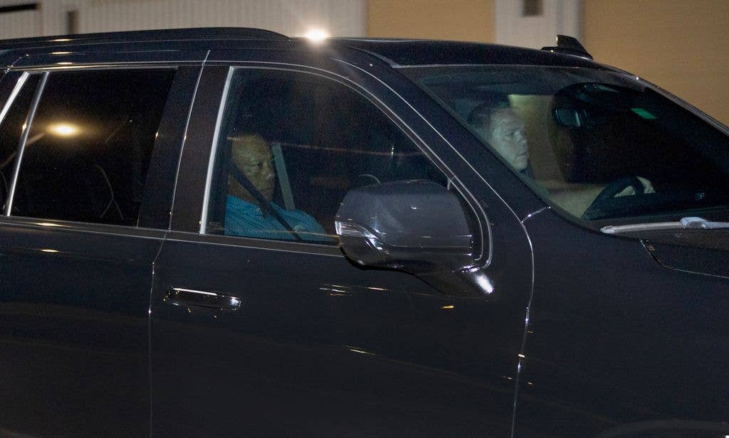 photo of tiger woods being driven in car away from martin county jail