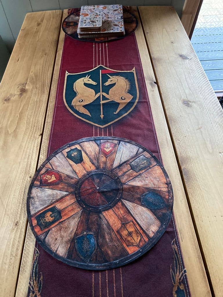 Wooden table decorated with medieval-style tablecloth