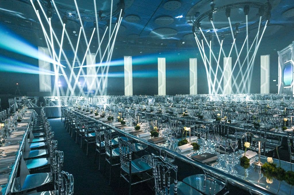 inside Monaco Rose Ball with a galactic theme tables and lights