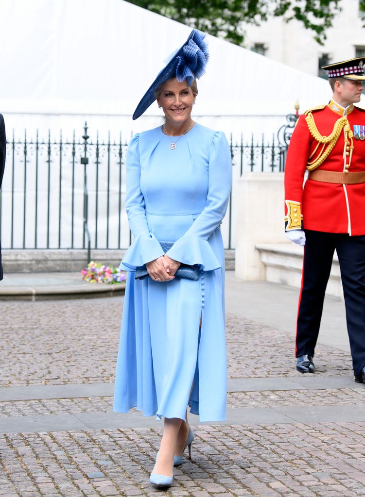 Sophie in pale blue dress, hat and shoes