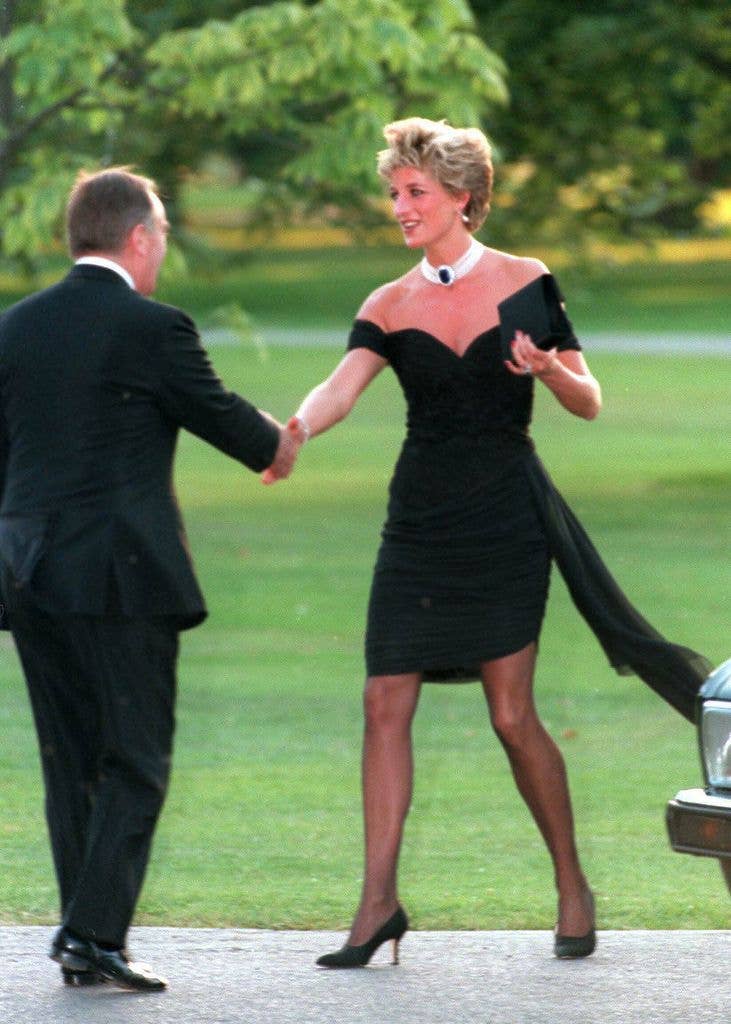 Diana, Princess of Wales, wearing a stunning black dress commissioned from Christina Stambolian, attends the Vanity Fair party at the Serpentine Gallery