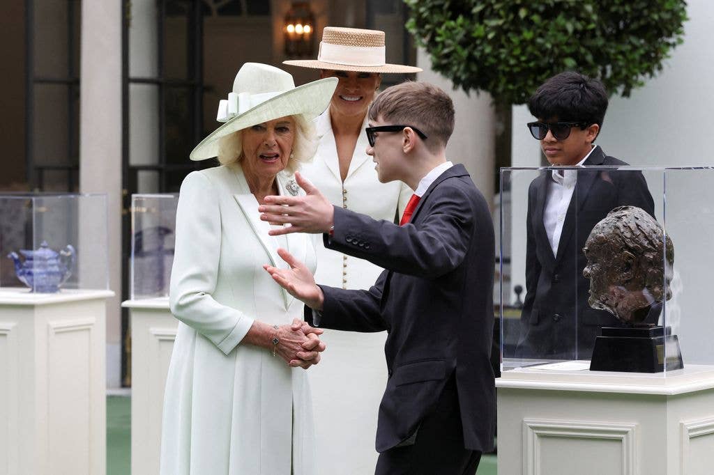 First lady Melania Trump and Britain's Queen Camilla watch students using AI-enabled glasses as they take part in a cultural educational event at the White House Tennis Pavilion, on April 28, 2026 in Washington, DC.