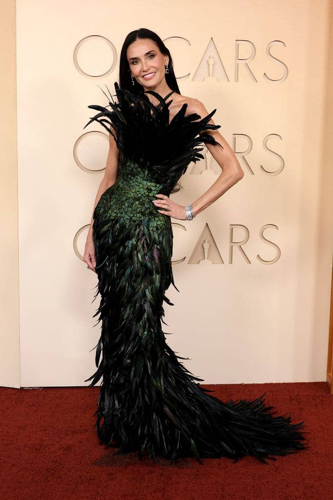 Demi Moore in feather Gucci dress