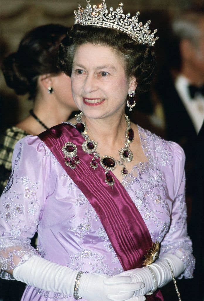 Queen Elizabeth in 1985 wearing lilac gown with tiara and necklace