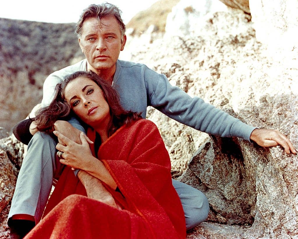 Elizabeth Taylor and Richard Burton  sat next to each other 