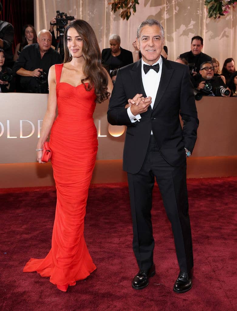 Amal Clooney in red dress and George Clooney in tuxedo at the 83rd Annual Golden Globe Awards at The Beverly Hilton