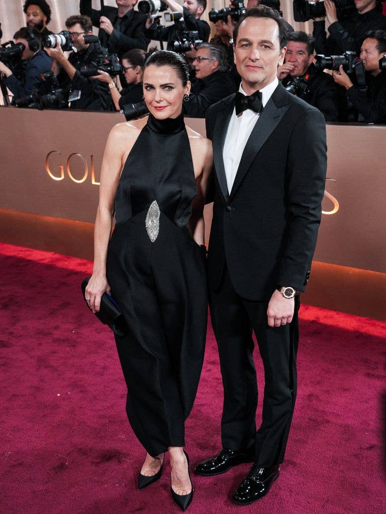 Keri Russell in black dress and Matthew Rhys in tuxedo at the 83rd Golden Globes awards 