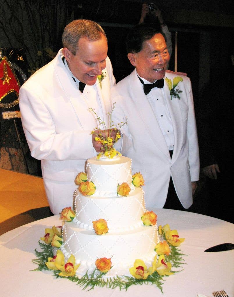 Actor George Takei (R) (the "Sulu" charactor on "Star Trek") and partner Brad Altman (L) prepare to cut the cake after they were married at the Japanese American National Museum on September 14, 2008 in Los Angeles.