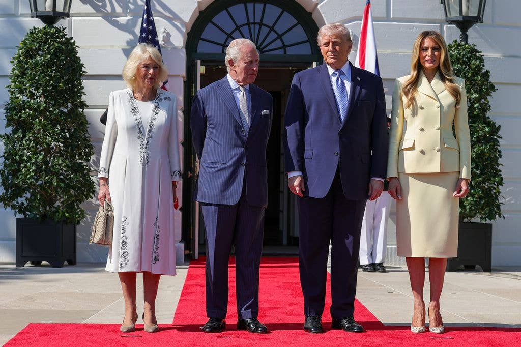 President Donald Trump and first lady Melania Trump stand with Queen Camilla and King Charles III on the South Lawn of the White House as they arrive for tea on day one of their State Visit to the United States of America, on April 27, 2026 in Washington, DC.