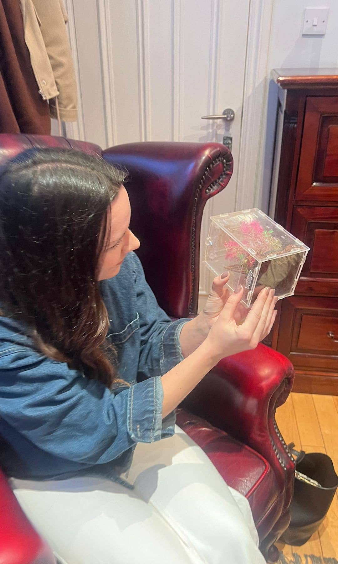 woman holding up plastic box