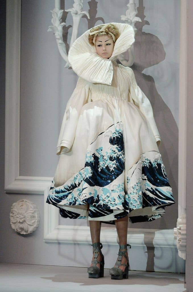 A model walks down the catwalk during the Christian Dior fashion show as part of Spring / Summer 2007 Haute Couture wearing a look inspired by The Great Wave off Kanagawa, also known as The Great Wave or simply The Wave, is a woodblock print by the Japanese ukiyo-e artist Hokusa