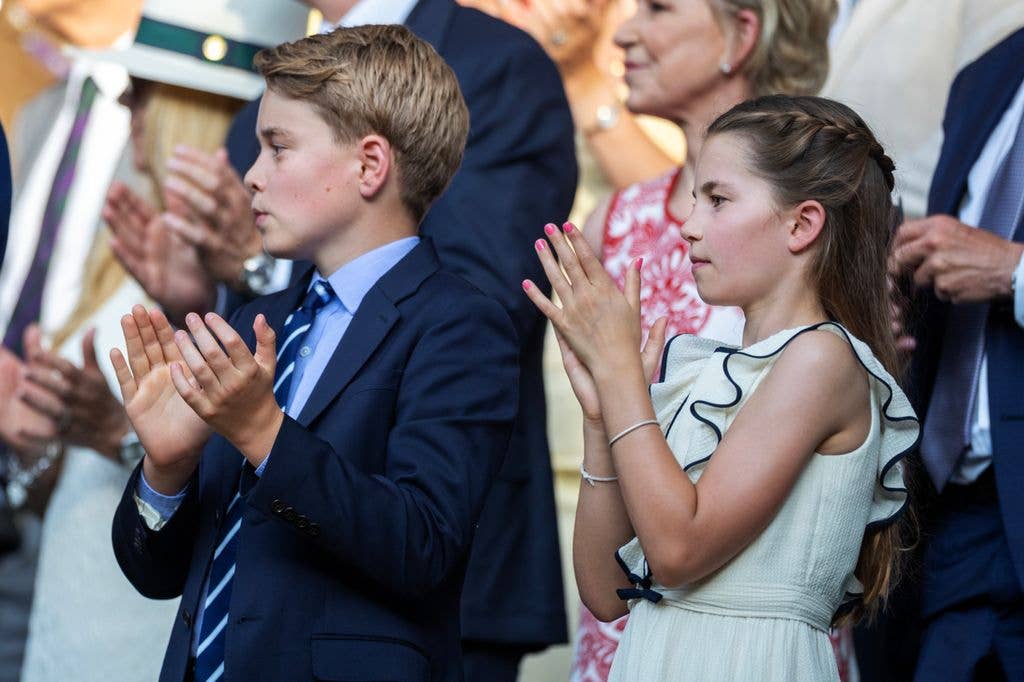 Prince George of Wales, and Princess Charlotte of Wales, applaud in the Royal Box at the Gentlemen's Singles Final on Centre Court during the Wimbledon Lawn Tennis Championships at the All England Lawn Tennis and Croquet Club at Wimbledon on July 13th, 2025, in London, England