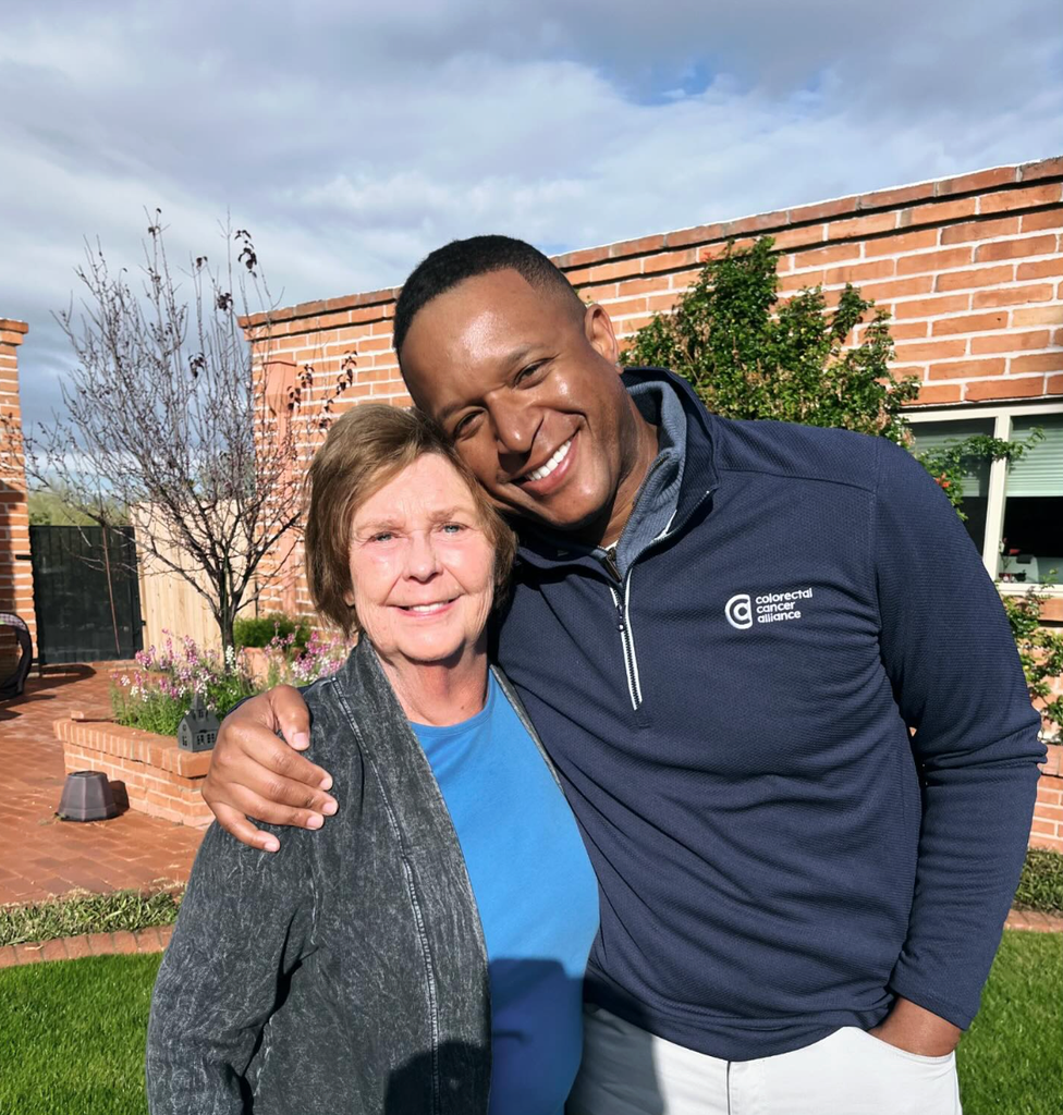 Craig Melvin in navy swearer and Nancy Guthrie in gray cardigan