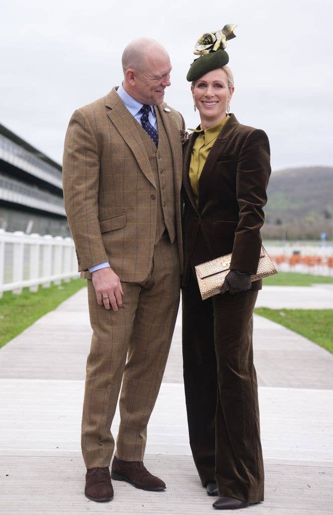 Mike in brown tweed suit and Zara Tindall  in green velvet suit and hat smiling