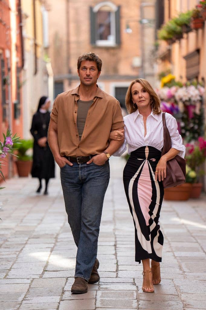 Lucas Bravo as Gabriel, Philippine Leroy-Beaulieu as Sylvie Grateau in episode 501 of Emily in Paris. 