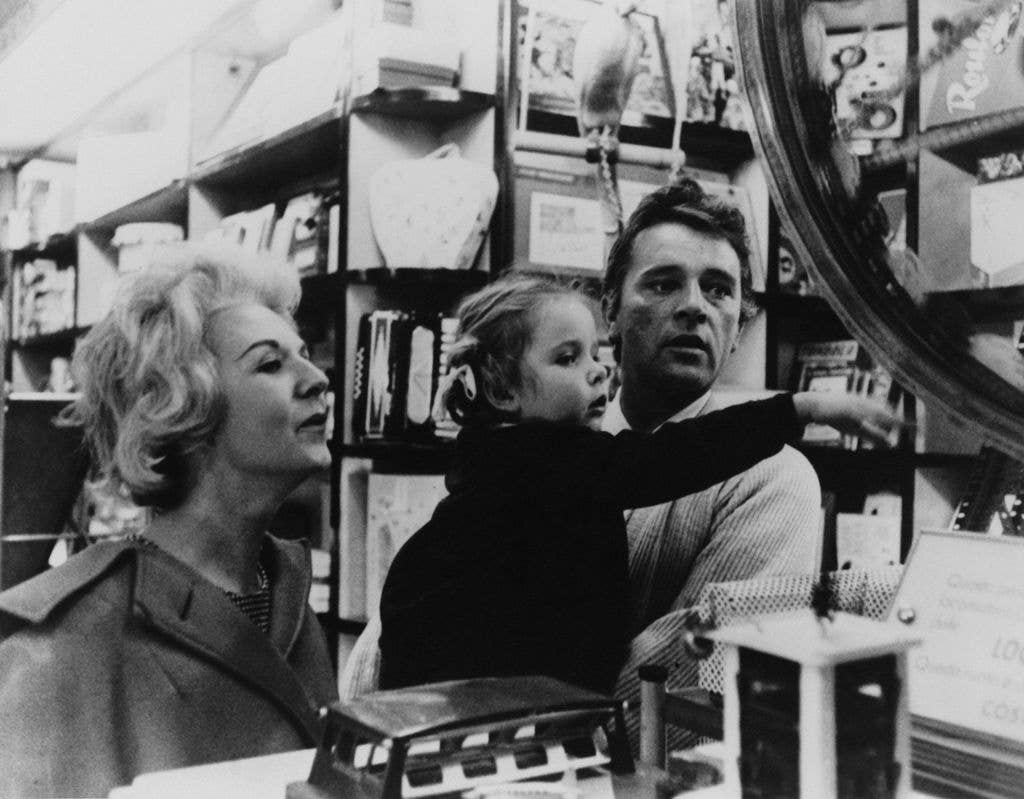 Welsh actor Richard Burton (1925 - 1984) visits a toy shop in Rome with his wife Sybil and their daughter Jessica, 1961. Burton is in the Italian capital for the location filming of 'Cleopatra'. 