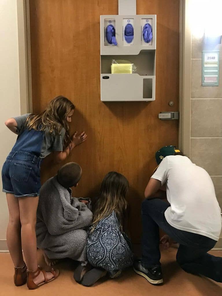 A photo of Joanna and Chip Gaines' four oldest children, Drake, Duke, Ella and Emmie, pressed up against a hospital door, shared on Instagram