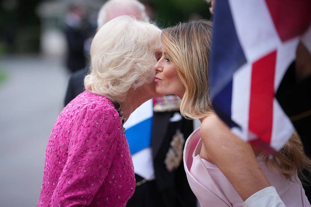 First lady Melania Trump greets Queen Camilla as she arrives for a state dinner at the White House on April 28, 2026 in Washington, DC.