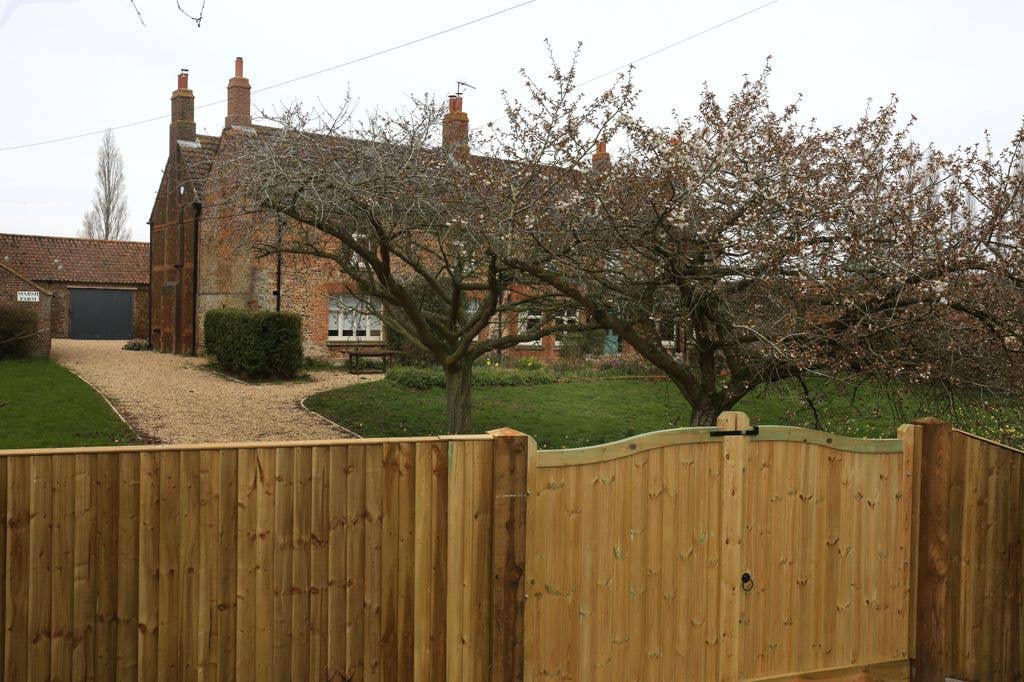 A general view of Marsh Farm showing new wooden gates where Andrew Mountbatten-Windsor is due to relocate from Wood Farm on the Sandringham estate