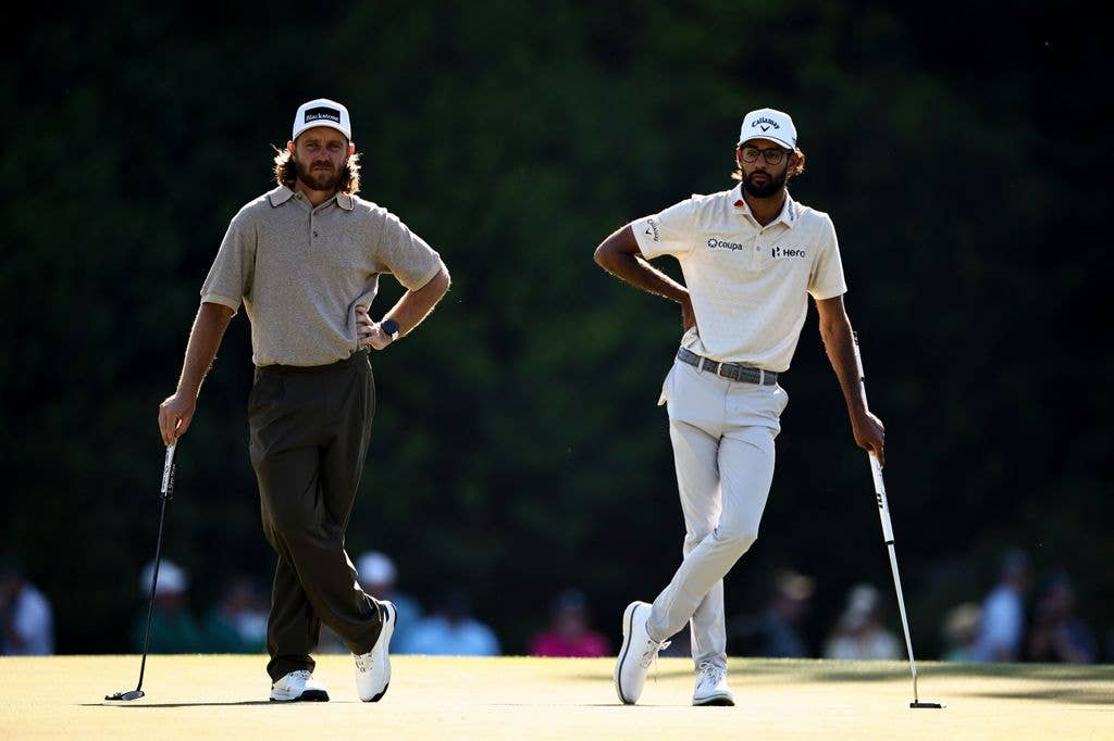Tommy Fleetwood of England and Akshay Bhatia of the United States wait on the 15th green during the second round of the 2026 Masters Tournament at Augusta National Golf Club on April 10, 2026 in Augusta, Georgia