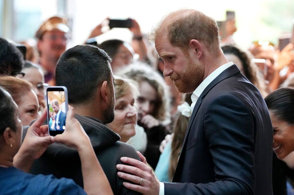 prince harry comforting man