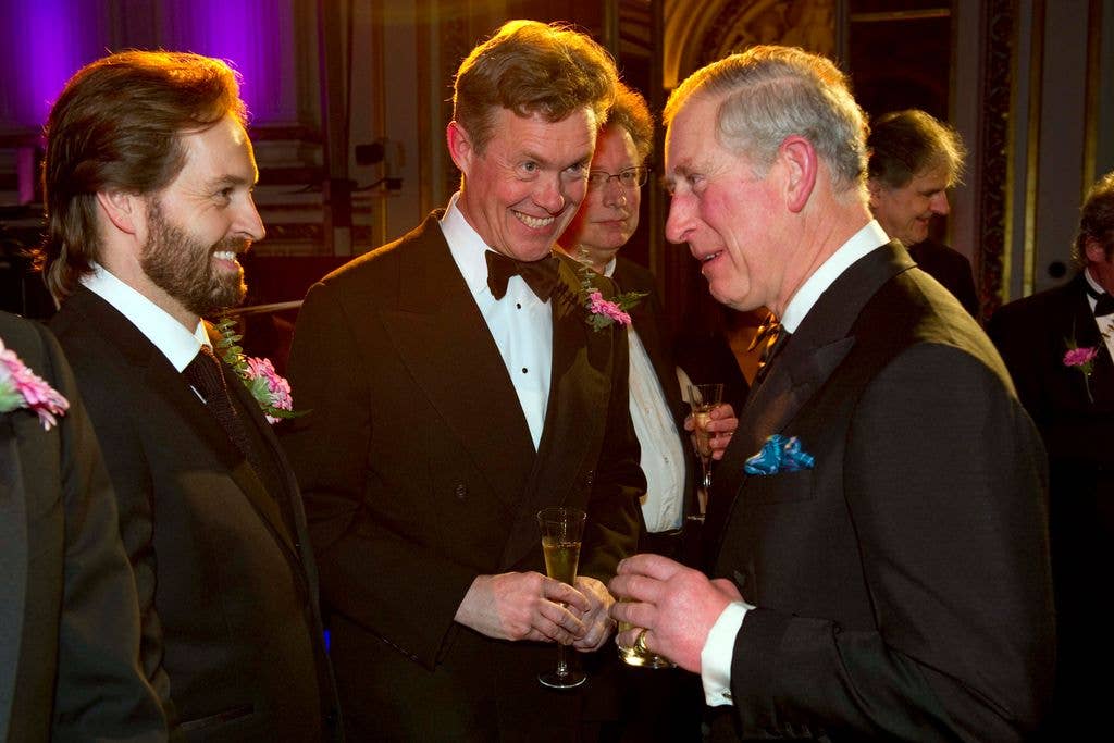 Alfie talks to the then-Prince Charles at a charity gala dinner in 2011 