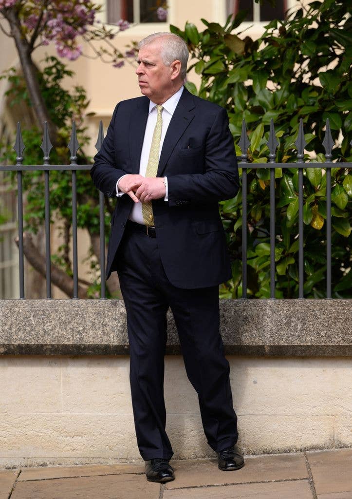 Andrew Mountbatten-Windsor in a suit and tie outside