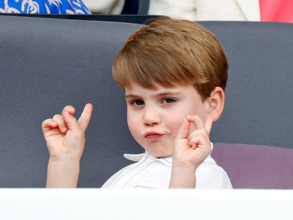 Prince Louis pulling funny face with hands