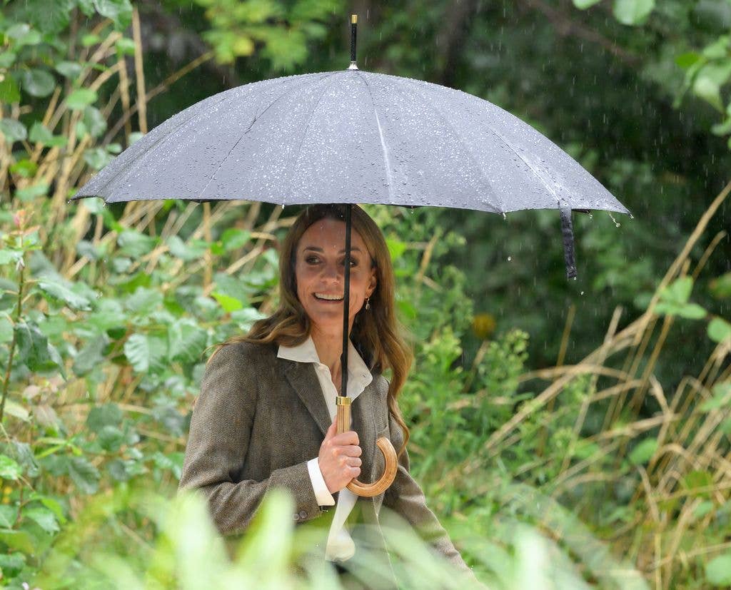 Catherine under umbrella in garden